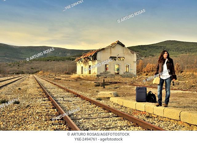 Woman in railway station. Buitrago de Lozoya, Madrid province, Spain