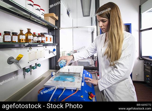 Doctoral student during her research work on a small film drawing bench in the laboratory at the Institute for Pharmaceutical Technology and Biopharmacy at the...
