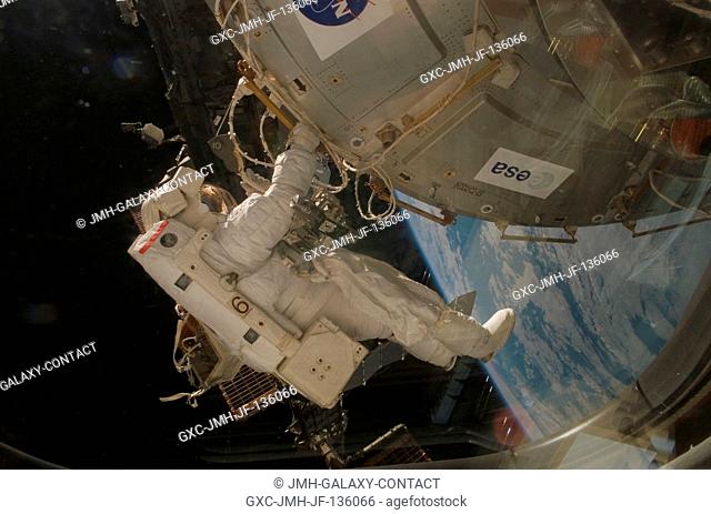 Astronaut Rex Walheim, STS-122 mission specialist, participates in the first scheduled session of extravehicular activity (EVA) as construction and maintenance...
