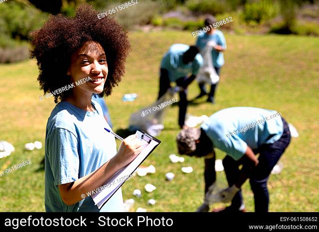 Volunteer mixed race woman enjoying her time outside