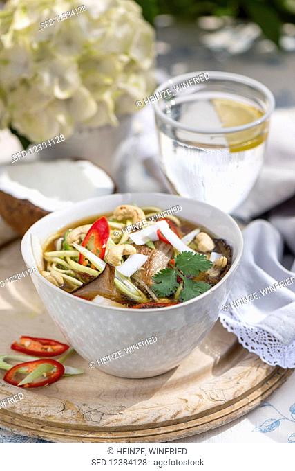 Noodle soup with mushrooms, chilies and cashew nuts (Asia)