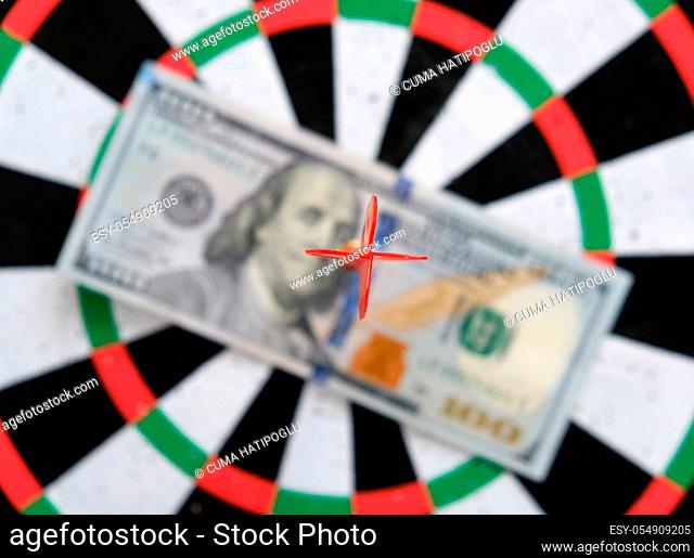 100 us dollar and dart arrows, dart board and 100 usd dollar