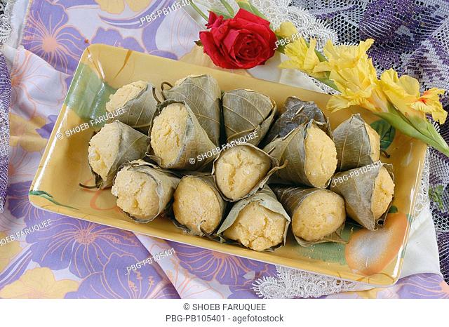 Pitha cakes: a sweetmeat of numerous varieties available in Bangladesh It is made of rice, pulse, milk and flour and mixed up with sugar and spices and fried in...