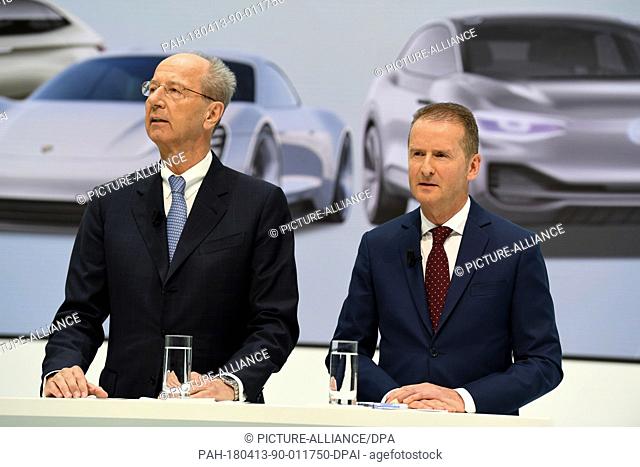13 April 2018, Germany, Wolfsburg: New CEO of Volkswagen Herbert Diess (R) and chairman of the governing body Hans Dieter Poetsch giving a press conference on...