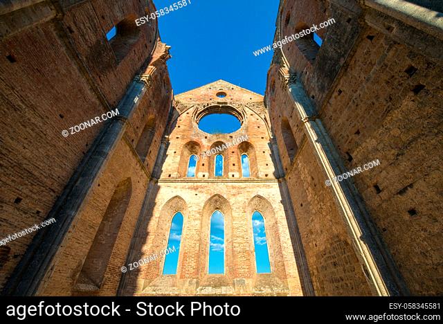 Internal view of the ruins of Medieval San Galgano Abbey near Siena, Italy - example of romanesque architecture in Tuscany