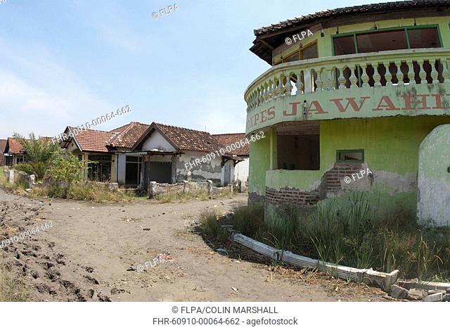 Abandoned village in dried mud following flooding by mud lake of mud volcano, environmental disaster which developed after drilling incident, Porong Sidoarjo