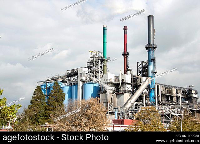 oil refinery skyline in europoort Netherlands with nature on foreground