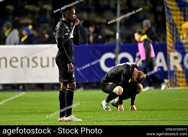Mechelen's Bill Antonio and Mechelen's David Bates look dejected after a soccer match between Royale Union Saint-Gilloise and KV Mechelen