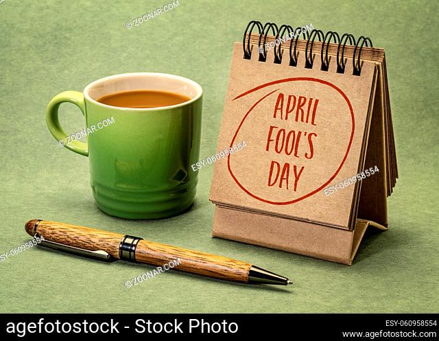 April Fools' Day -handwriting in a desktop calendar with a cup of coffee