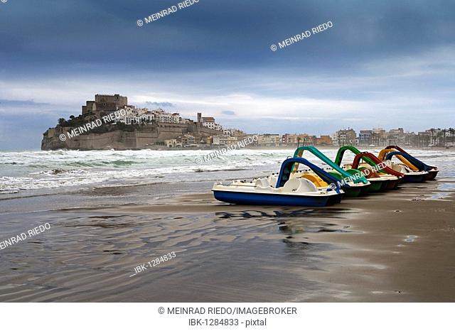 Stormy atmosphere, paddle boats on the sandy beach of Peniscola, Costa Azahar, Spain, Europe