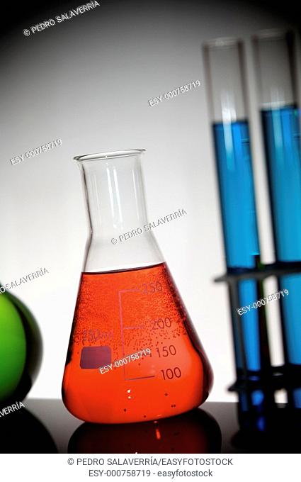flask with bright red liquid in chemistry lab
