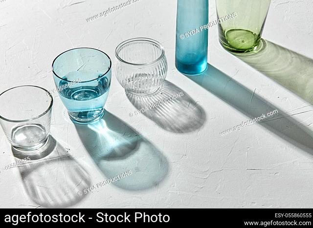 glassware dropping shadows on white surface