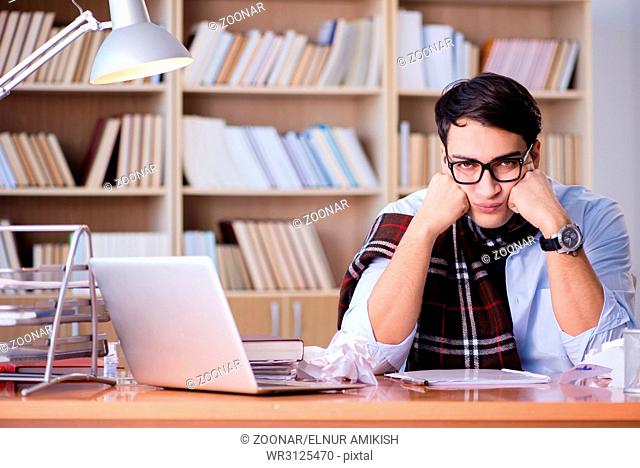 The young writer working in the library
