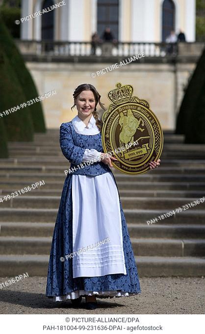 04 October 2018, saxon, Radebuel: Lina Trepte, the 24th Dresden Stollen Girl, holds the seal of the Dresden Stollen in her hands at a press event at Wackerbarth...