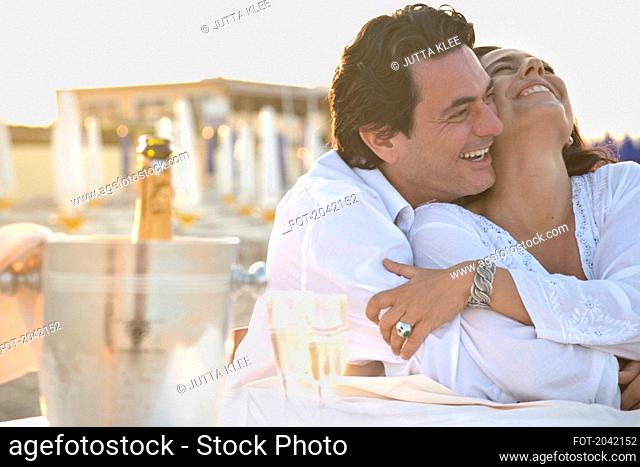 Couple on Beach Hugging