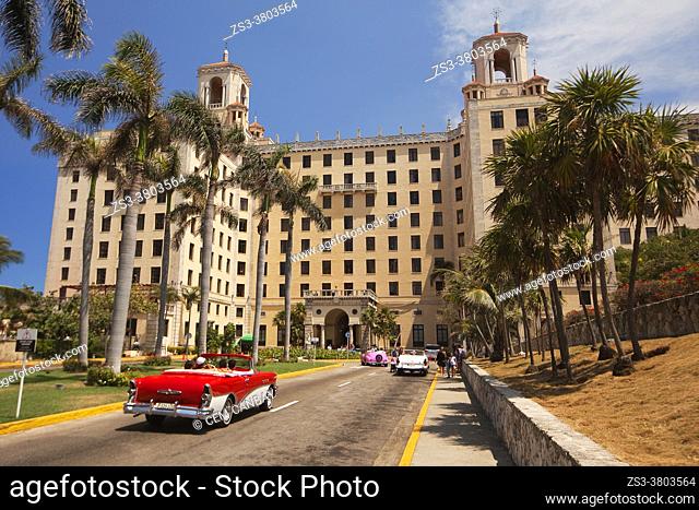 Old American car used as taxi in front of the Hotel Nacional at Vedado district, Havana , La Habana, Cuba, West Indies, Central America