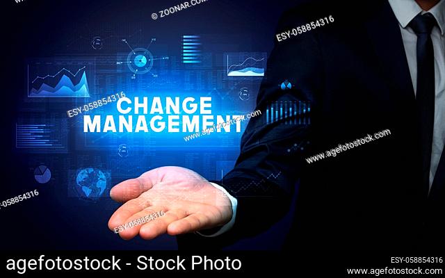 Hand of Businessman holding CHANGE MANAGEMENT inscription, business success concept