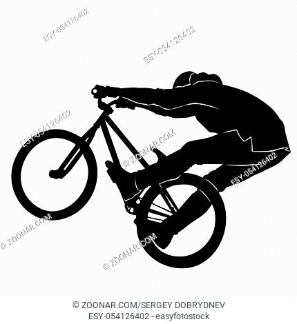 Teenager riding a BMX bicycle in blacek and white