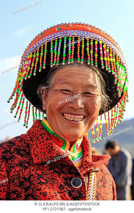 Chinese woman in traditional Miao attire during the Heqing Qifeng Pear Flower festival, China