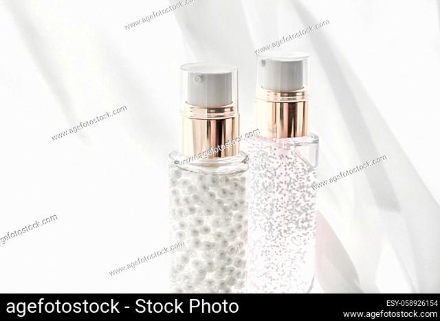Cosmetic branding, moisture and spa concept - Skincare serum and make-up primer gel bottle, moisturizing lotion and lifting cream emulsion