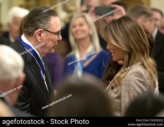 United States Army General John M. ""Jack"" Keane (retired), left, and first lady Melania Trump, right, following the ceremony where US President Donald J