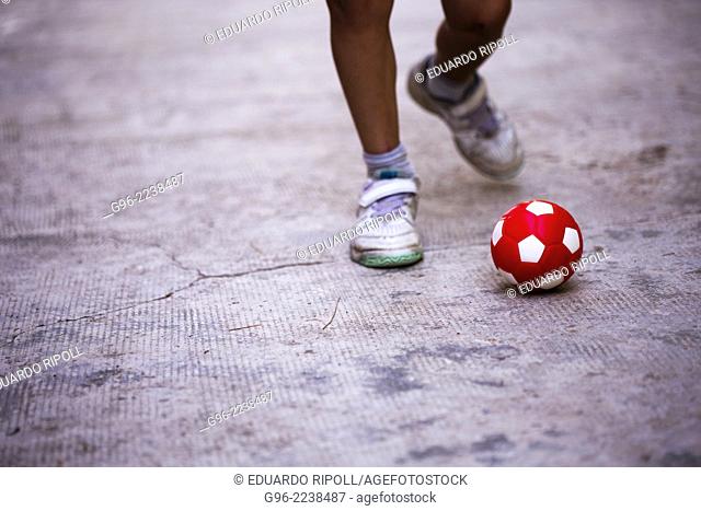 a boy shooting a ball
