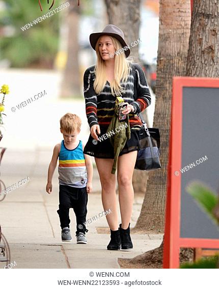 Makeup free Hilary Duff wearing a felt hat and a short black skirt, takes son Luca Comrie to Pint Size Kids Featuring: Hilary Duff