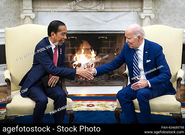 United States President Joe Biden shakes hands with President Joko Widodo of Indonesia, in the Oval Office of the White House in Washington, DC, US, on Monday