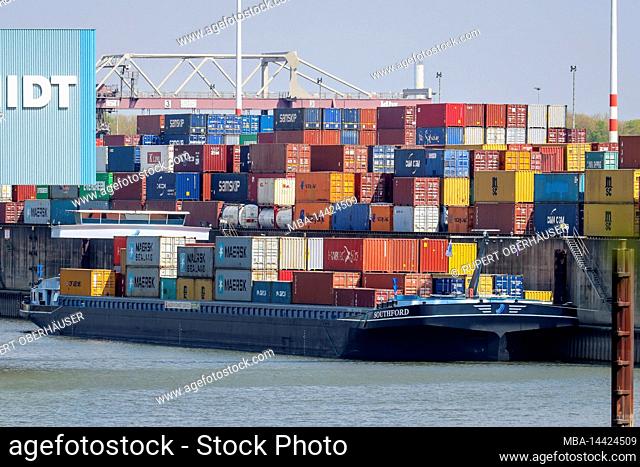 Duisburg, North Rhine-Westphalia, Germany - Duisburg port, cargo ships with containers at the container terminal in the container port