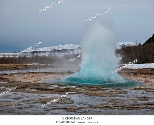 The outbreak of Strokkur Geysir at Golden Circle in winter