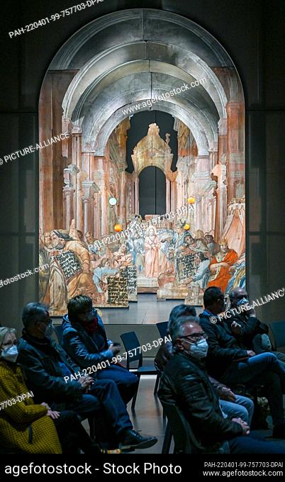 01 April 2022, Brandenburg, Neuzelle: Guests of the opening sit in front of the scenery theater with the scene ""Jesus before Annas"" in the Museum Heavenly...