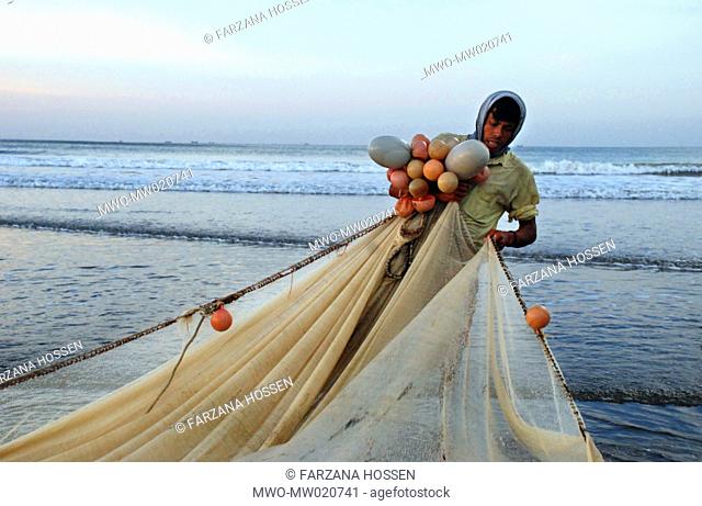 A fisherman at Cox's Bazar, one of the most popular tourist destinations in Bangladesh because of its longest stretch of natural beach in the world November 13