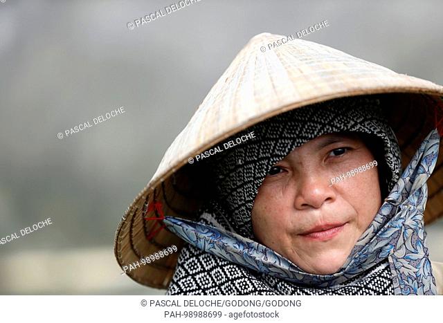 Vietnamese farmer with conical hat. Portrait. Kon Tum. Vietnam. | usage worldwide. - Kon Tum/Kon Tum/Vietnam