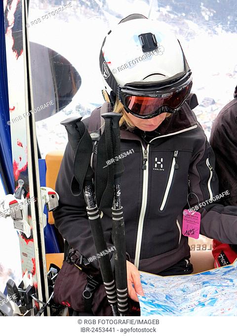 Skier studied card during a gondola ride in St. Anton am Arlberg, Tyrol, Austria, Europe