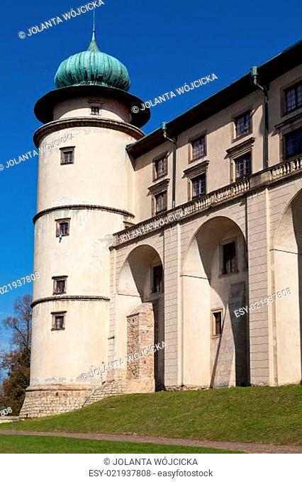 view on castle Nowy Wisnicz in Poland on a background of blue sky