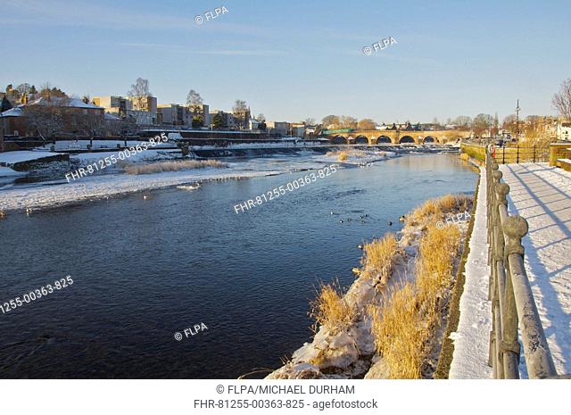 View of partially frozen river and bridge, River Nith, Dumfries, Dumfries and Galloway, Scotland, december