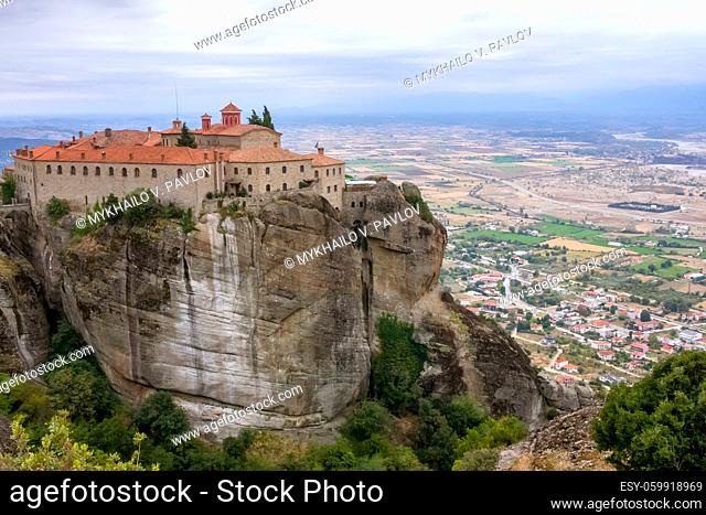 Greece. Summer day in Meteora. Monastery on a high cliff above the town