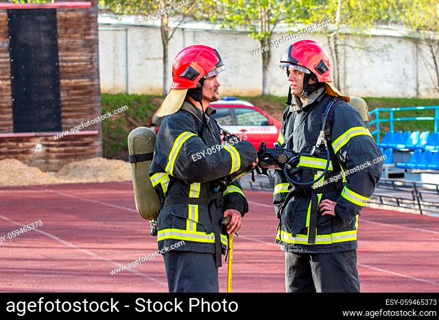 Portrait of two heroic fireman