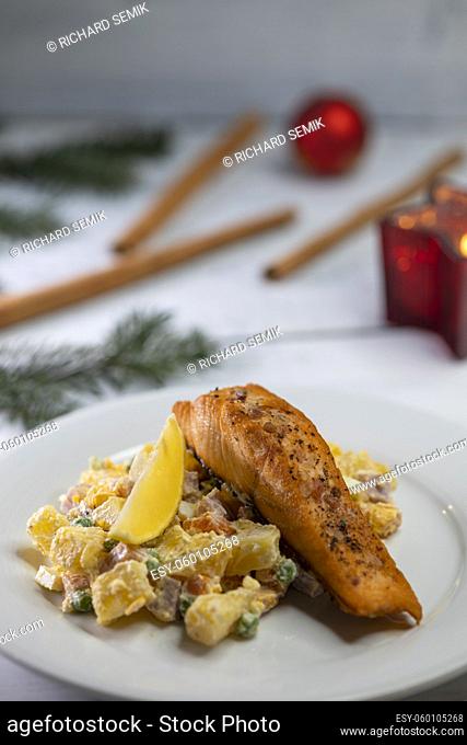 Traditional Christmas dinner in Czech Republic - salmon fillet with potato salad