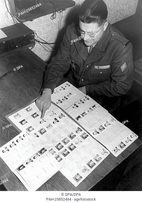 A French officer shows a file with all soldiers of the Moroccan troops in Germany on the 15th of December in 1958 in Reutlingen