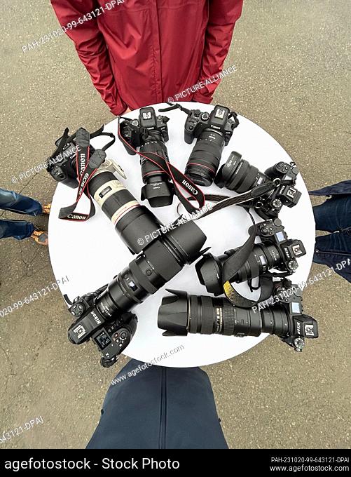 20 October 2023, Saxony, Dresden: Photographers placed their cameras on a table at the topping-out ceremony of the Stadtforum