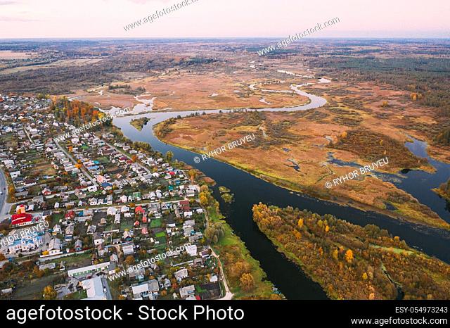 Dobrush, Gomel Region, Belarus. Aerial View Of Dobrush Cityscape Skyline In Autumn Evening. Residential District And River In Bird's-eye View