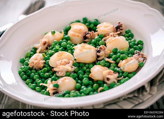 Cuttlefish with peas on a plate. High quality photo