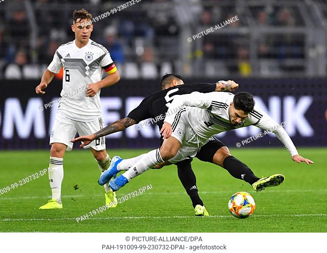 09 October 2019, North Rhine-Westphalia, Dortmund: Soccer: International matches, Germany - Argentina at Signal Iduna Park: Suat Serdar from Germany fights with...