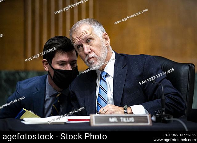 United States Senator Thom Tillis (Republican of North Carolina) listens to a member of his staff as Federal Reserve Chair Jerome Powell and Treasury Secretary...