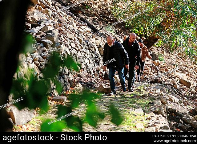 21 October 2023, Saxony-Anhalt, Thale: Hikers walk on the popular hiking trail ""Schurre"" through the Bode Valley. Because of its rocky ascent