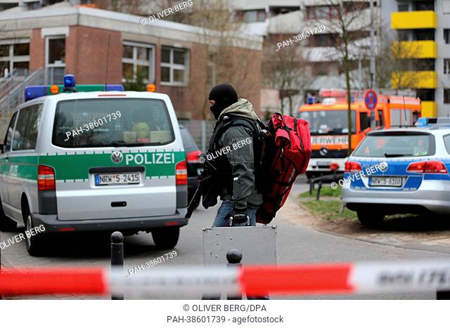 Police forces gather in front of a day care center, in which people have been taken hostage, in Cologne, Germany, 05 April 2013