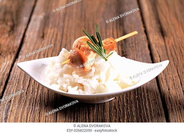 Chicken skewer on bed of white rice