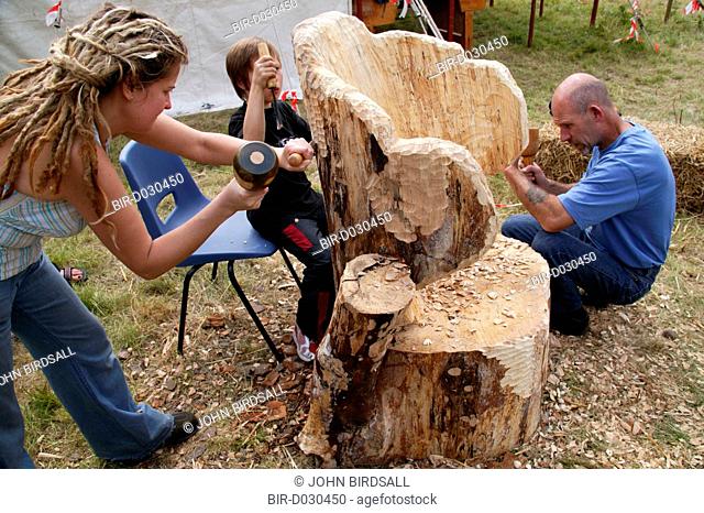 Newstead Tree Fest, group of people carving an armchair from a tree trunk
