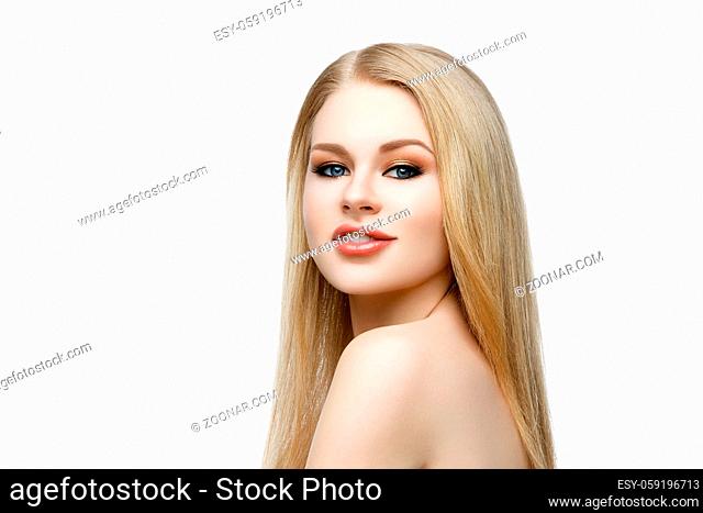 Closeup portrait of beautiful young woman with messy long blond hair and bright makeup. Beauty shot. Isolated over white background. Copy space